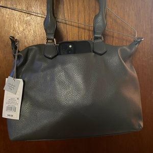 Grey purse. New with tags. Side pocket for phone. Target